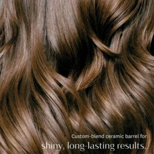 Close-up of shiny, wavy brown hair with text overlay: “BodyWaver 1 ¾" Barrel’s custom-blend ceramic barrel delivers shiny, long-lasting results.”. - SAAB Salon Spa | Ottawa On, Canada