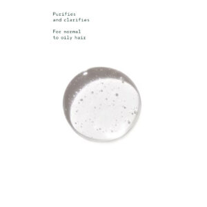 A drop of clear, viscous Rosemary Mint Shampoo containing small bubbles, with text reading: “Purifies and clarifies. For normal to oily hair.” - SAAB Salon Spa | Ottawa On, Canada