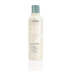 Shampure Nurturing Conditioner in a beige plastic bottle with a sage green cap, featuring botanical graphics and text. - SAAB Salon Spa | Ottawa On, Canada