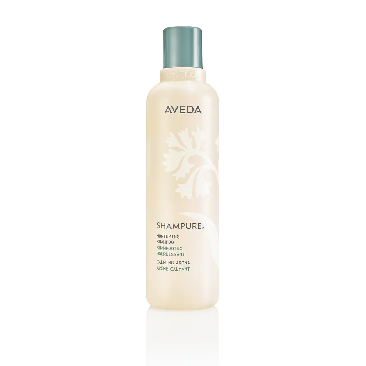 Beige bottle of Shampure Nurturing Shampoo with a teal cap and floral graphic. - SAAB Salon Spa | Ottawa On, Canada