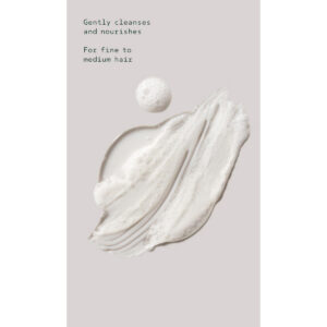 A smear of Shampure Nurturing Shampoo, clear and foaming, on a light gray background with the text: “Gently cleanses and nourishes. For fine to medium hair.” - SAAB Salon Spa | Ottawa On, Canada
