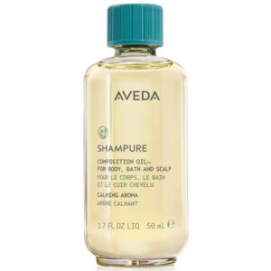 A clear bottle of Shampure Composition Oil featuring pale yellow oil, a teal screw cap, and text on the label. - SAAB Salon Spa | Ottawa On, Canada