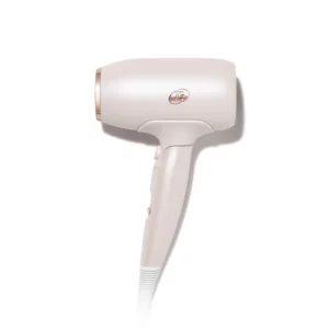 The T3 Fit hair dryer features a compact design in matte white and rose gold, displayed against a white background. - SAAB Salon Spa | Ottawa On, Canada