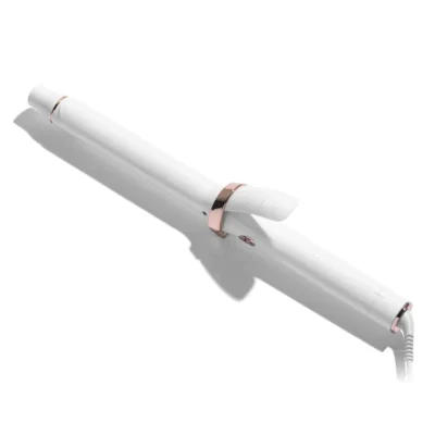 A white and rose gold hair curling iron with a clamp, shown on a white background. - SAAB Salon Spa | Ottawa On, Canada