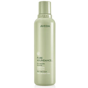 A light green bottle of Pure Abundance Volumizing Shampoo for fine hair, displaying the product name on the front. - SAAB Salon Spa | Ottawa On, Canada