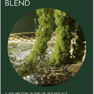 Close-up of green botanical strands submerged in water, illustrating Pure Abundance Volumizing Shampoo’s uplifting botanical blend for fuller-looking hair. - SAAB Salon Spa | Ottawa On, Canada