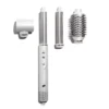 A white multi-styling hair tool with interchangeable attachments: a blow dryer nozzle, a curling barrel, and a round brush. - SAAB Salon Spa | Ottawa On, Canada