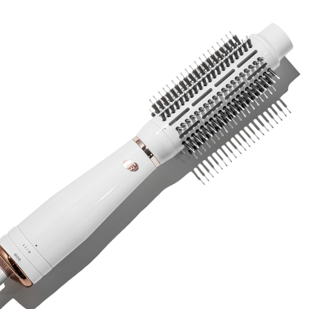 The T3 Airebrush (Copy) is a white and rose gold electric round hair brush with bristles, designed for styling and drying hair. - SAAB Salon Spa | Ottawa On, Canada
