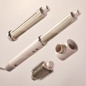 The T3 Aire360, a white and gold hair styling tool, features multiple detachable attachments—curling barrel, straightening barrel, brush, and round roller—shown on a neutral background. - SAAB Salon Spa | Ottawa On, Canada