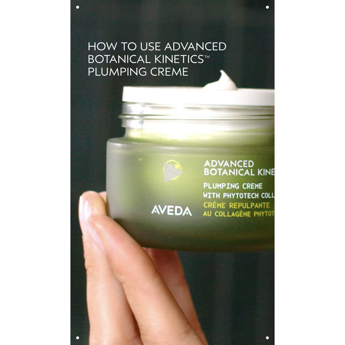 A hand holds an open jar of Advanced Botanical Kinetics Plumping Milky Lotion, with some lotion visible on the rim. - SAAB Salon Spa | Ottawa On, Canada