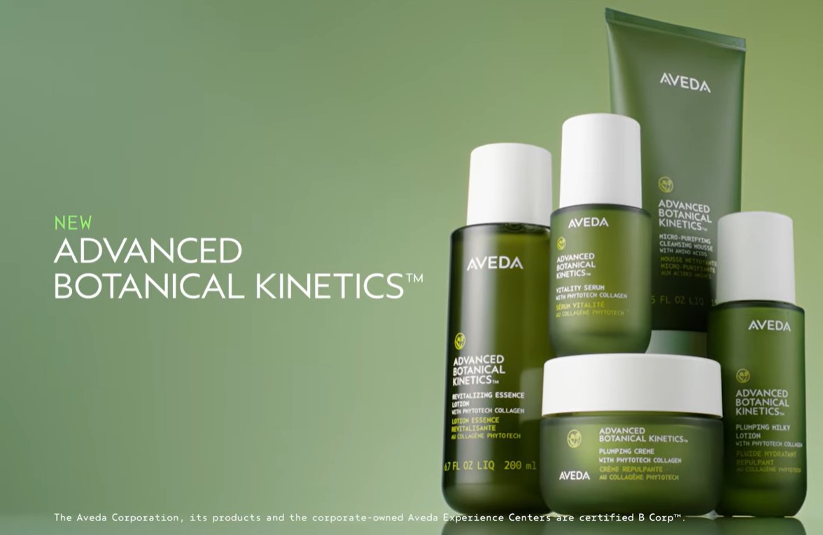 Five green skincare bottles and jars from Aveda’s Advanced Botanical Kinetics line are arranged on a green background with product names visible. - SAAB Salon Spa | Ottawa On, Canada