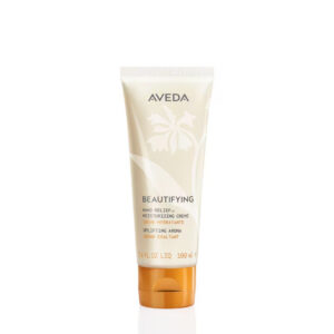 A cream-colored tube of Beautifying Hand Relief Moisturizing Hand Creme with a copper-colored flip cap. - SAAB Salon Spa | Ottawa On, Canada