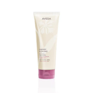 Off-white squeeze tube of Cherry Almond Softening Conditioner with a dark pink cap. - SAAB Salon Spa | Ottawa On, Canada