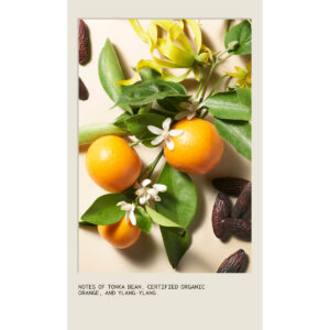 Cherry Almond Softening Shampoo shown with oranges, ylang-ylang flowers, and tonka beans, and text reading: “Notes of tonka bean, certified organic orange, and ylang-ylang.” - SAAB Salon Spa | Ottawa On, Canada