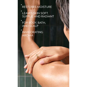 A person applies Rosemary Mint Composition Oil For Body, Bath And Scalp to their arm, with text noting it restores moisture for soft, radiant skin and offers an invigorating aroma. - SAAB Salon Spa | Ottawa On, Canada